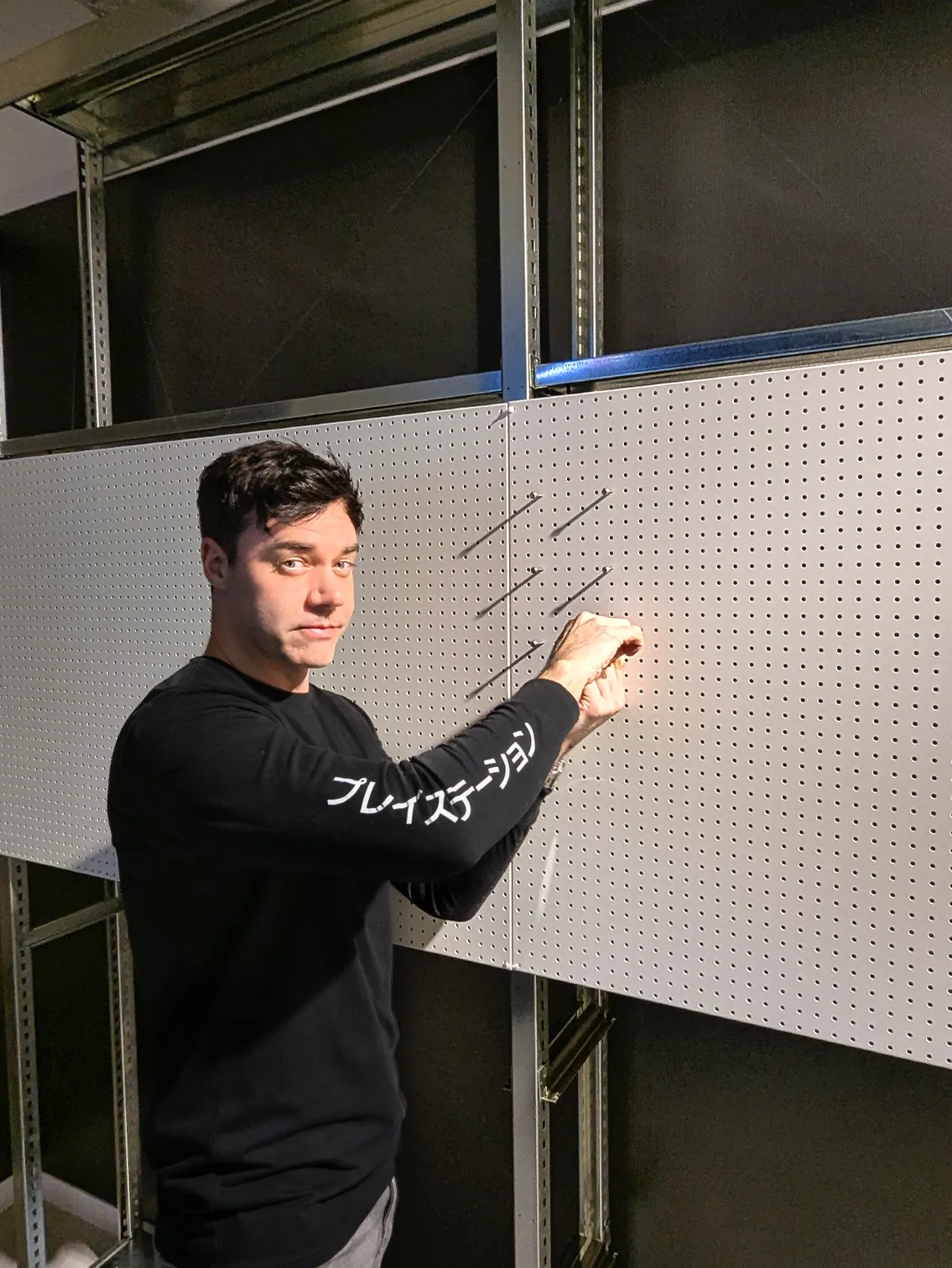 Eoin starting the pegboard wall build