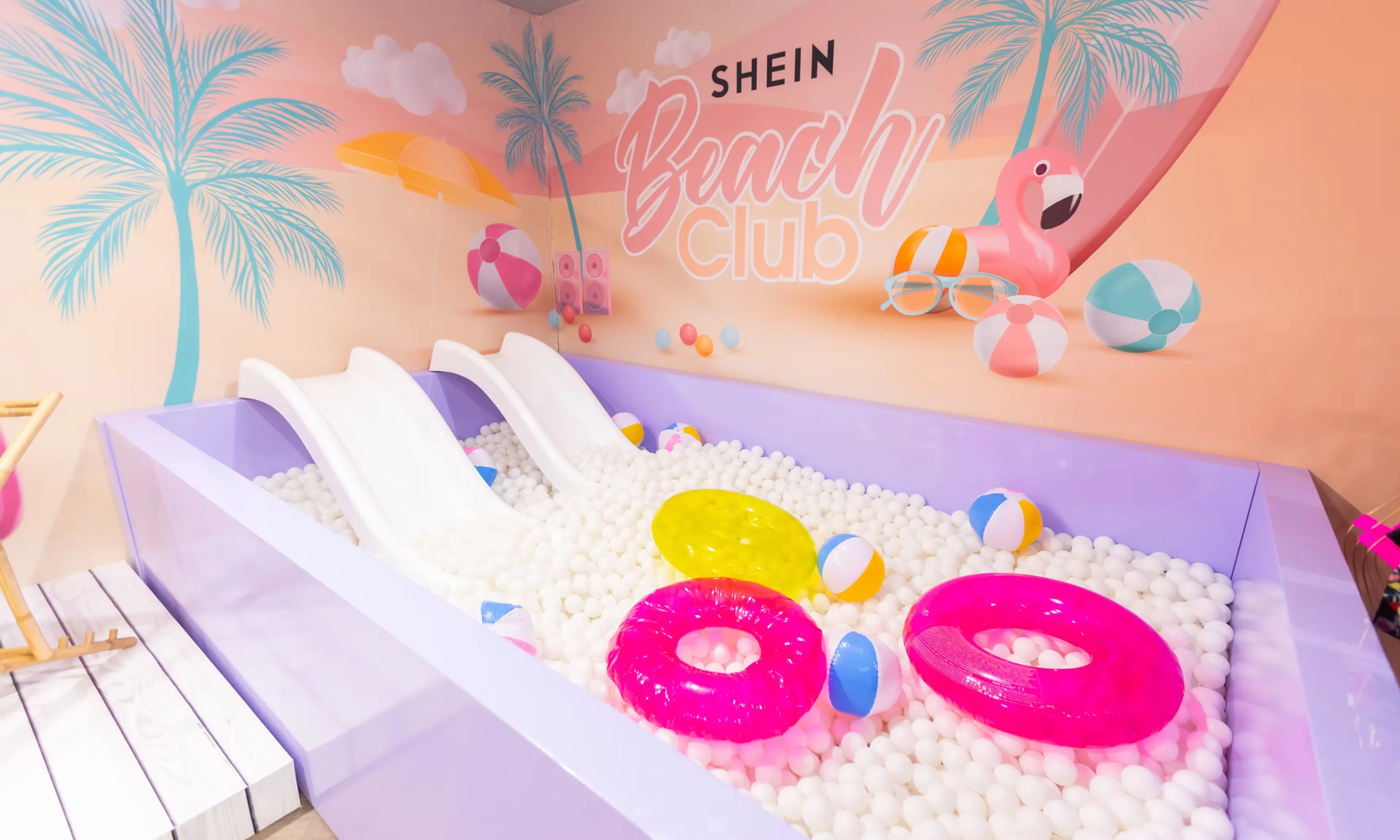 SHEIN — ball pit installation with Beach Club mural