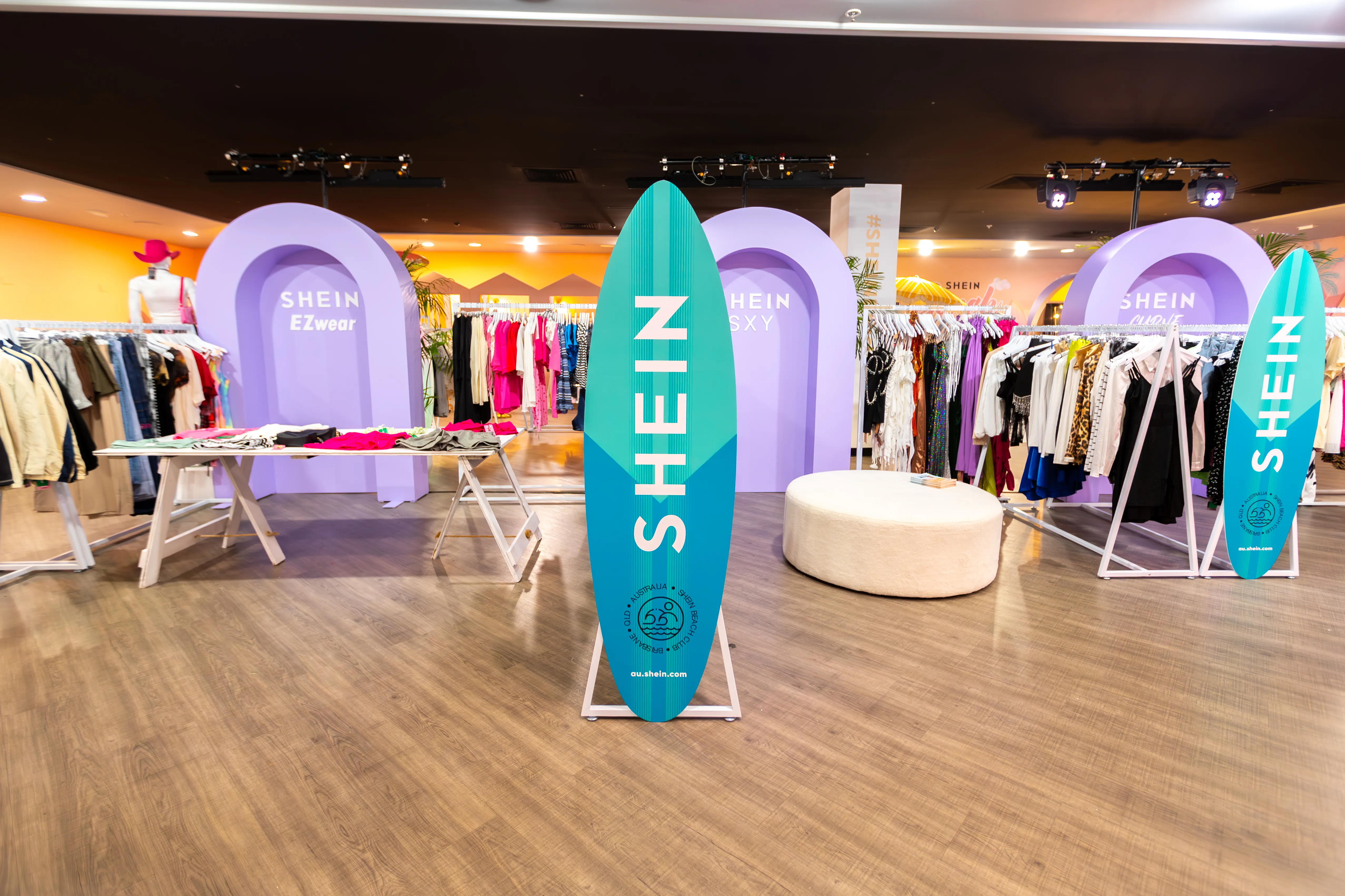 SHEIN — full retail floor, surfboard standees and category arches
